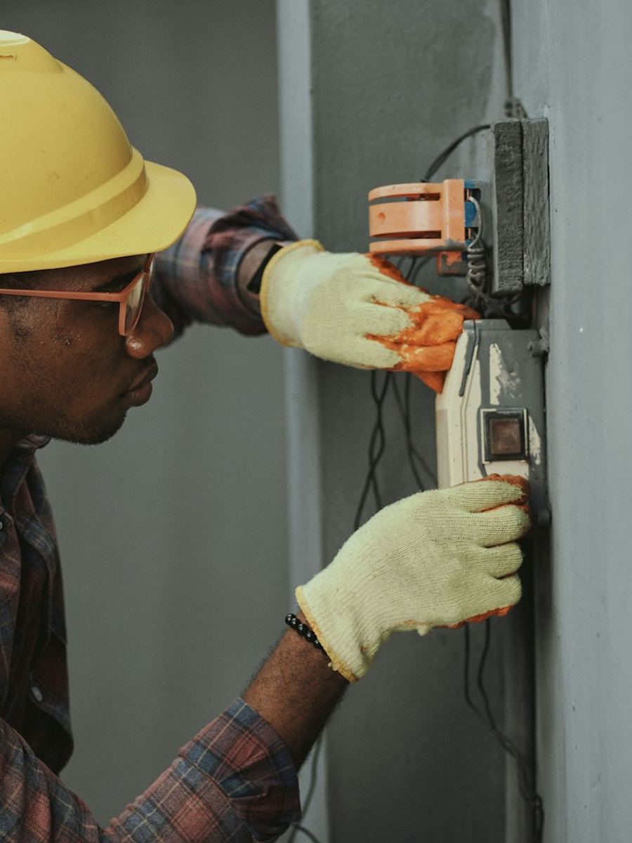 Electrician working on an electrical panel
